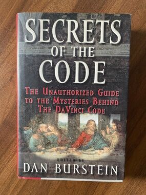 Secrets of the Code by Dan Burstein — Hardcover Book, Red/Black/Cream Cover